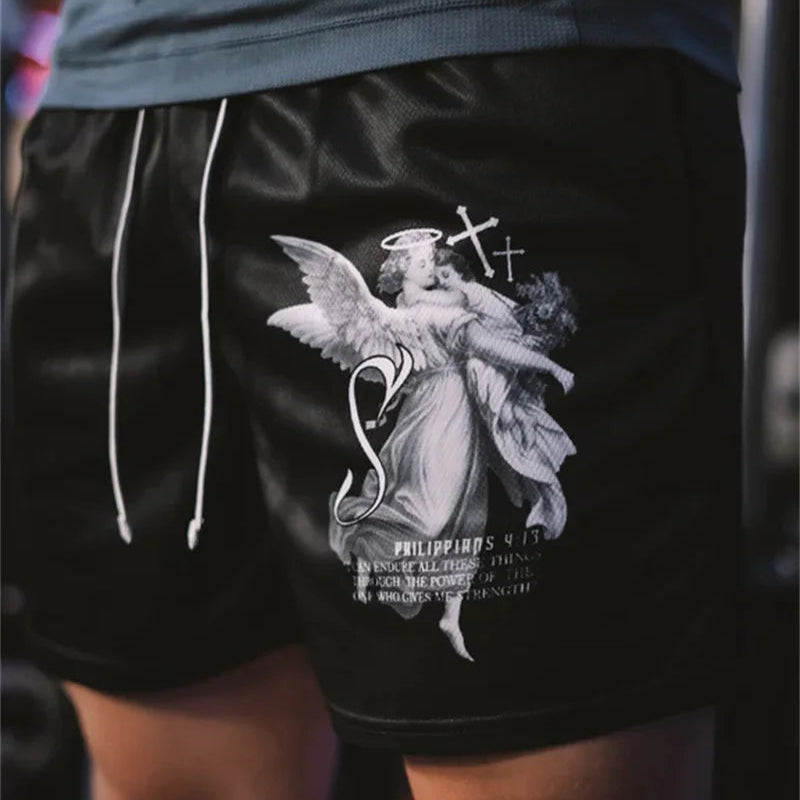Black shorts with an angel graphic design worn by a person.