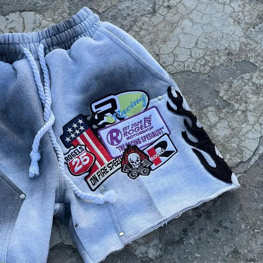 Gray sweatshirt with patches on a textured surface