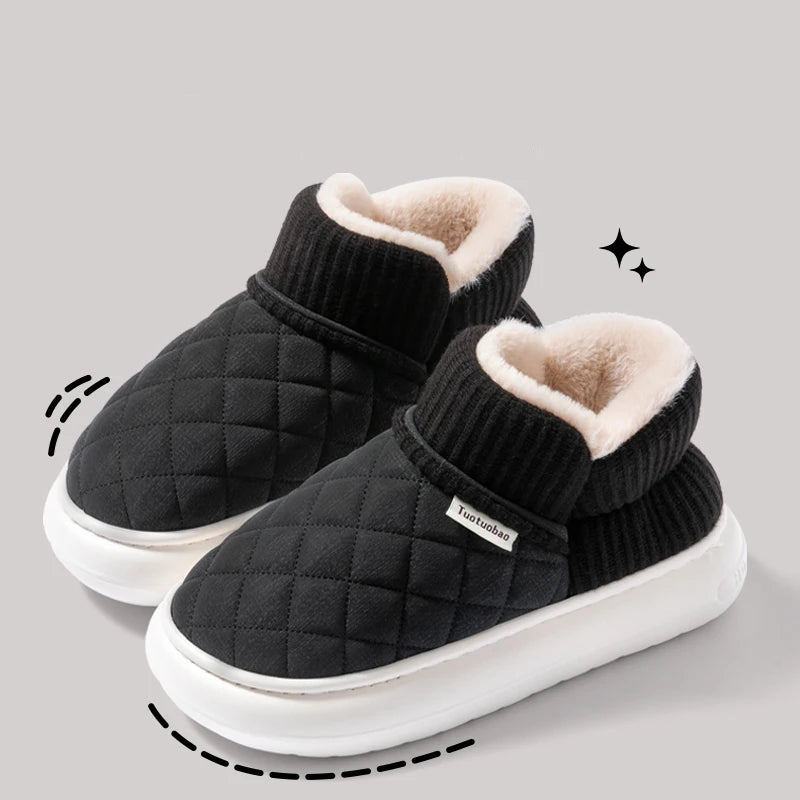 Black quilted slippers with white soles on a gray background, featuring text about warmth and comfort.