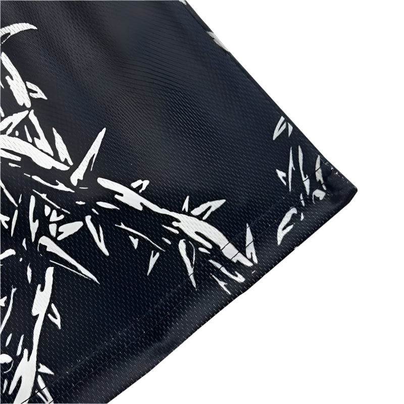 Black fabric with white bamboo pattern on a white background