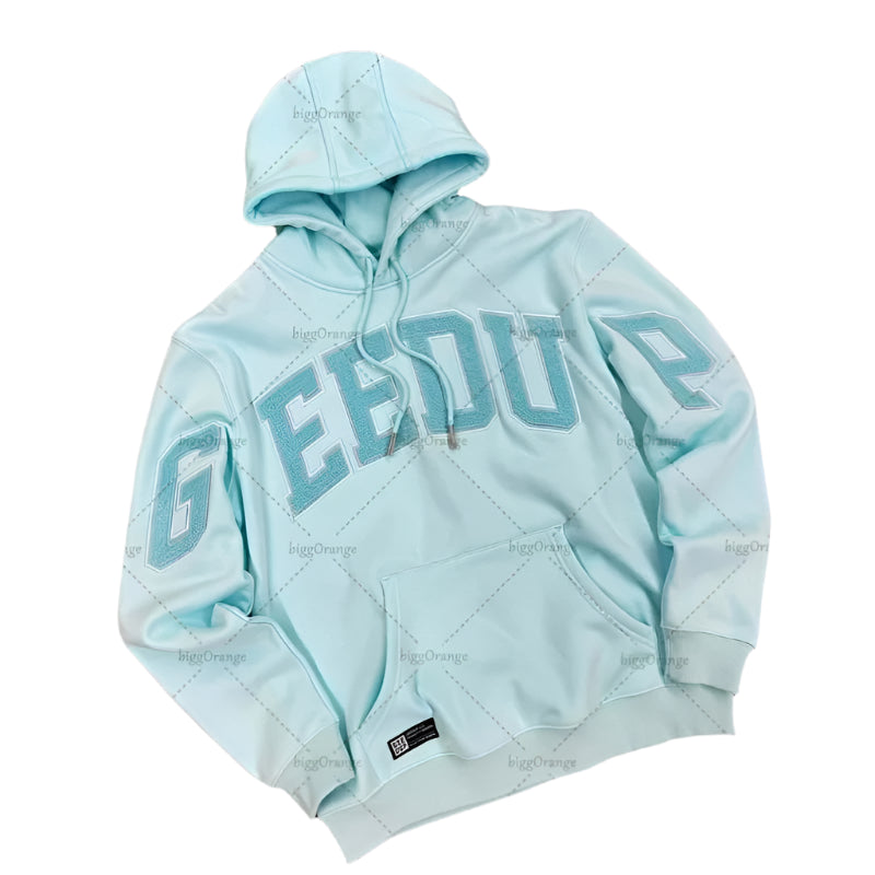 Light blue hoodie with 'GEE DU' text on a gray textured background