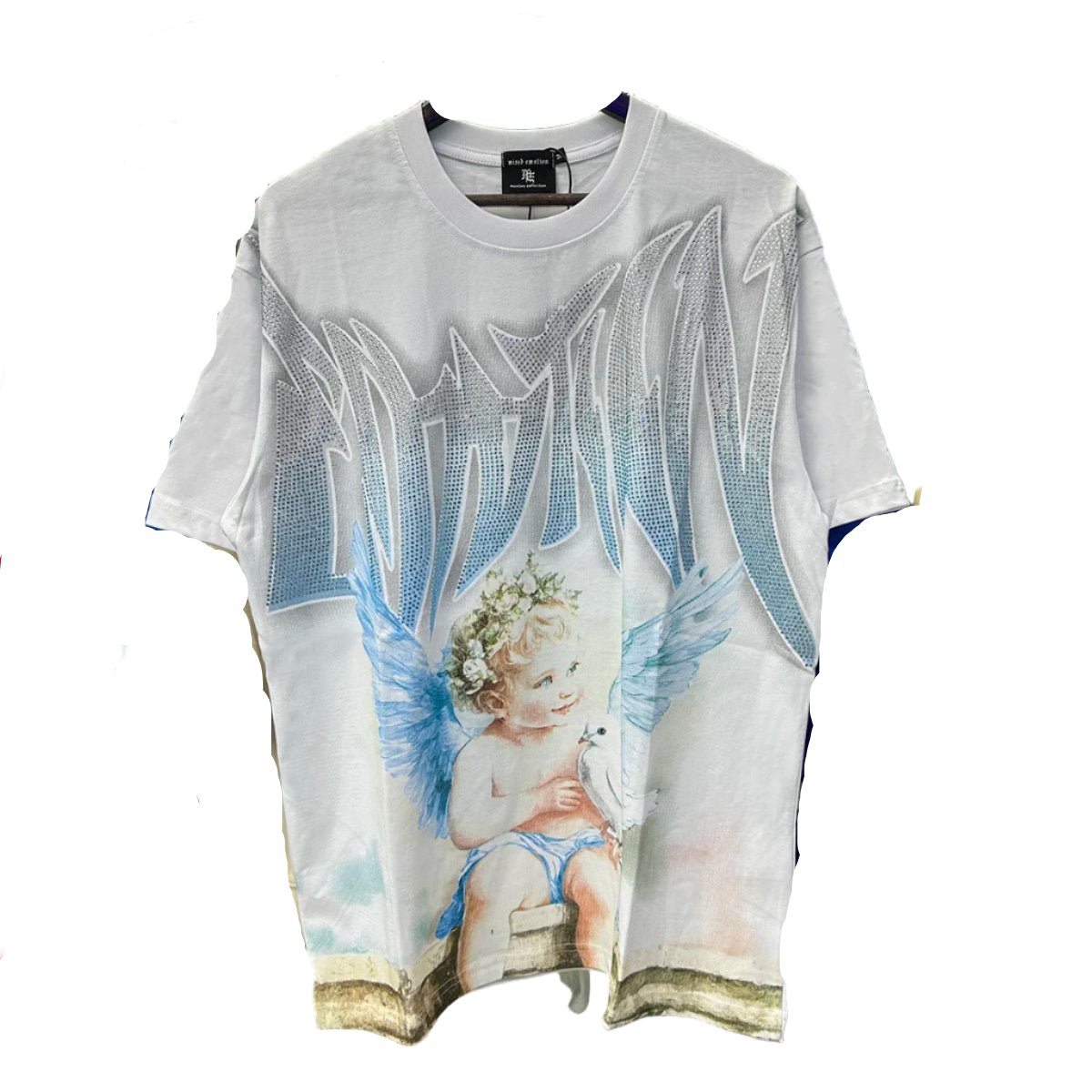 White t-shirt with angel design on a rack of clothes