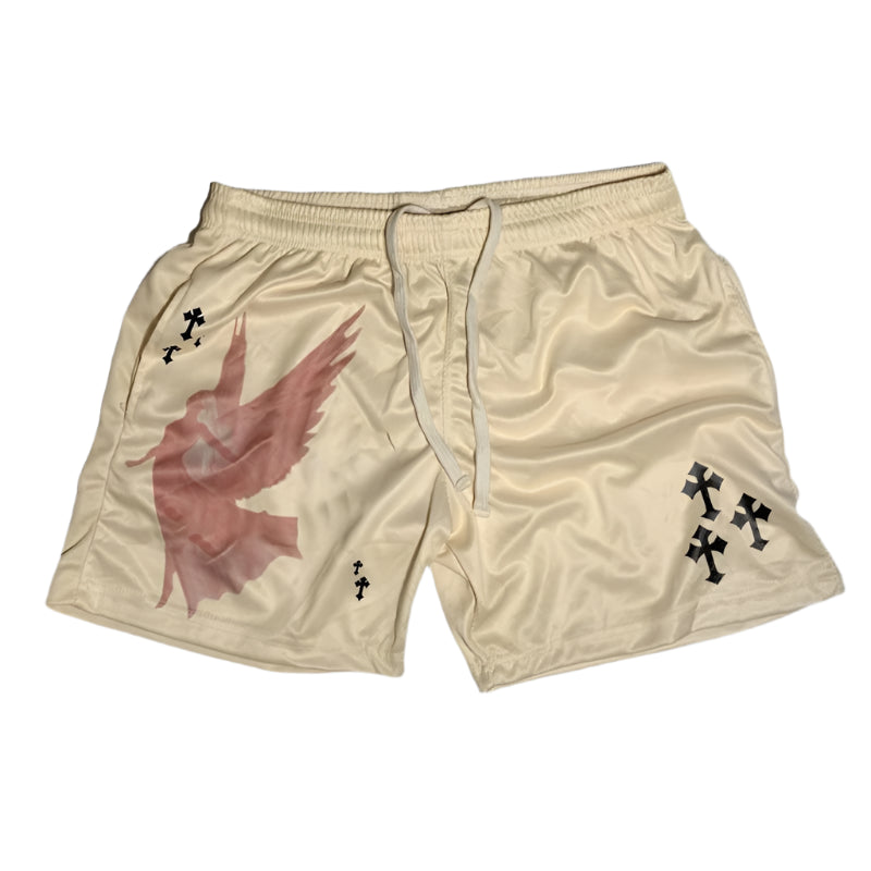 Beige shorts with a red bird design and black crosses on a gray concrete background