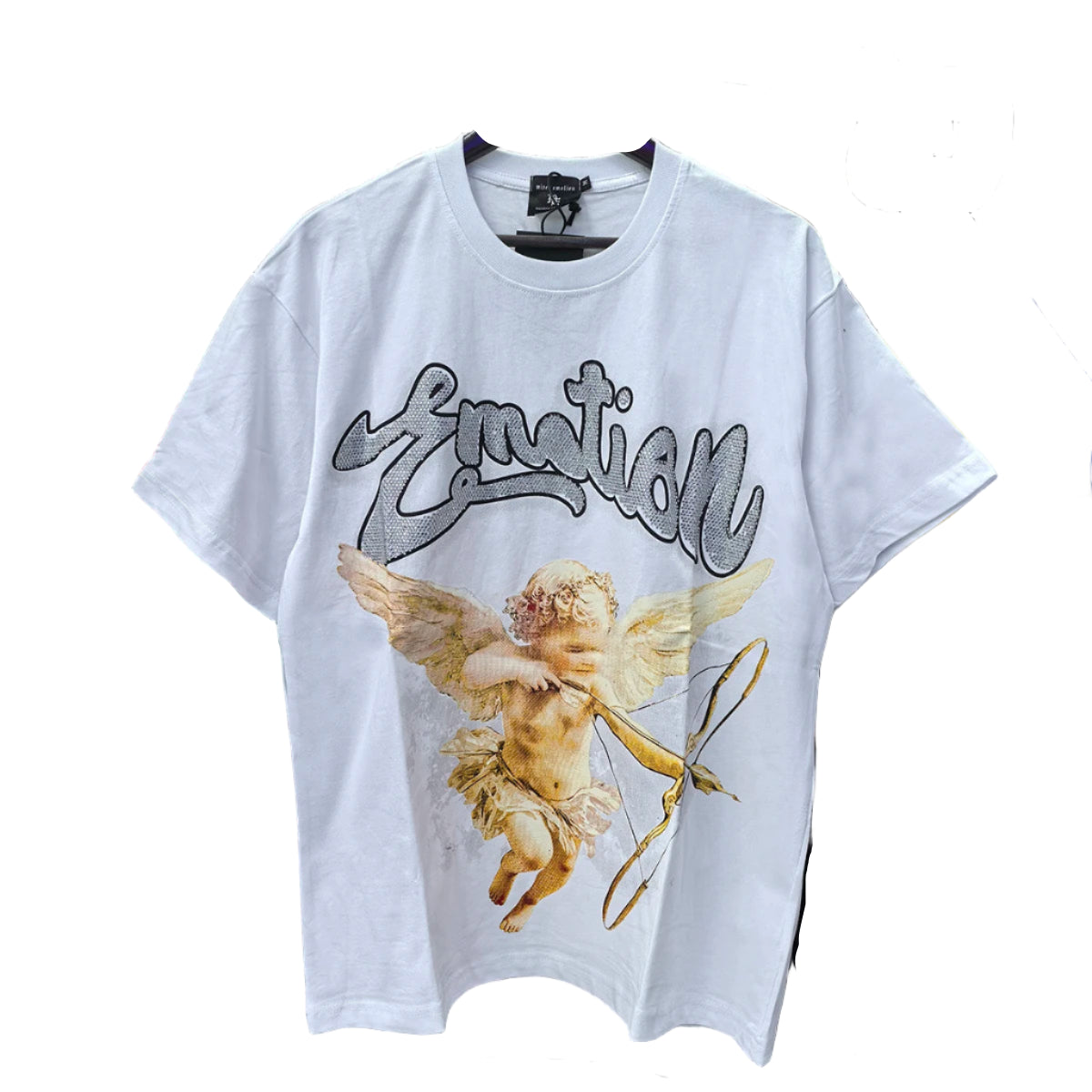 White t-shirt with angel graphic and 'Emotion' text hanging among other clothes.