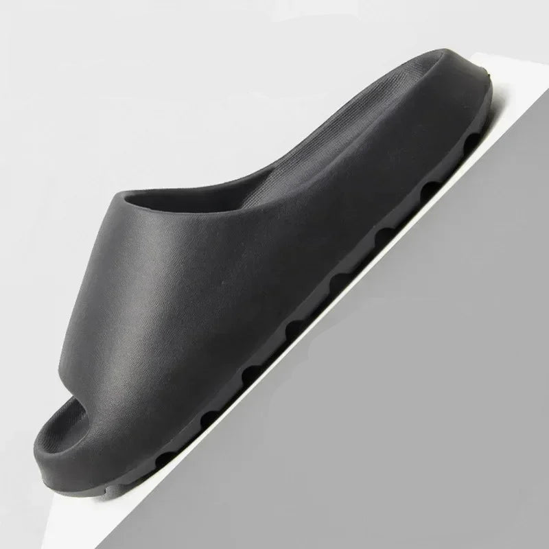 Black slip-resistant shoe sole with detailed texture on a gray background