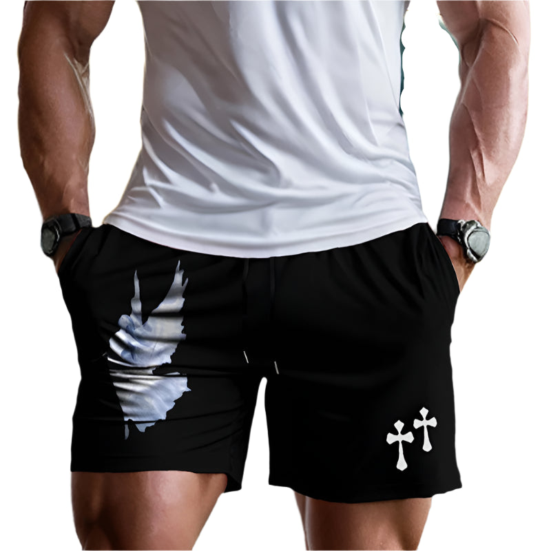Person wearing a white t-shirt and black shorts with a design, standing in a gym setting.