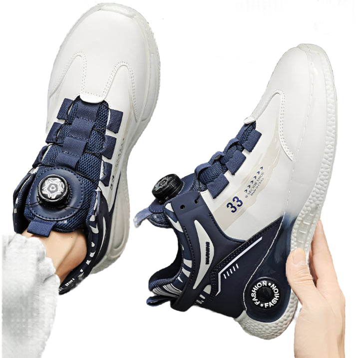 White and blue sneakers with a unique design held by a hand against a gray background.