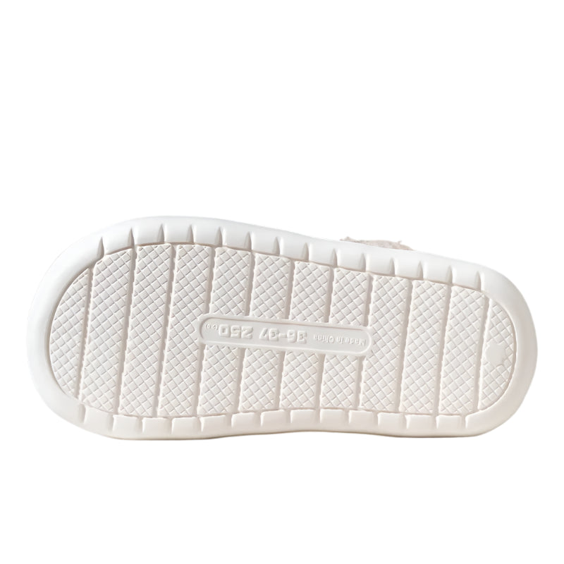 White shoe sole with anti-slip pattern on a neutral background