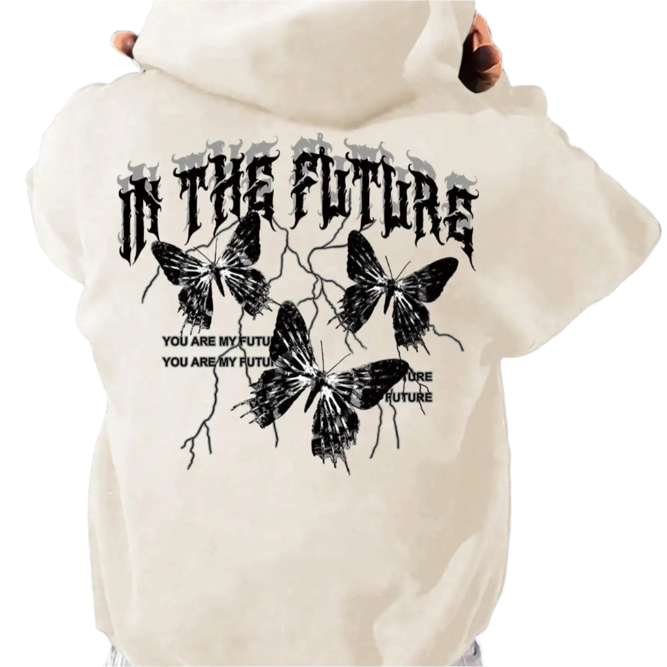 Person wearing a beige hoodie with butterfly design and text on the back, standing against a striped wall.