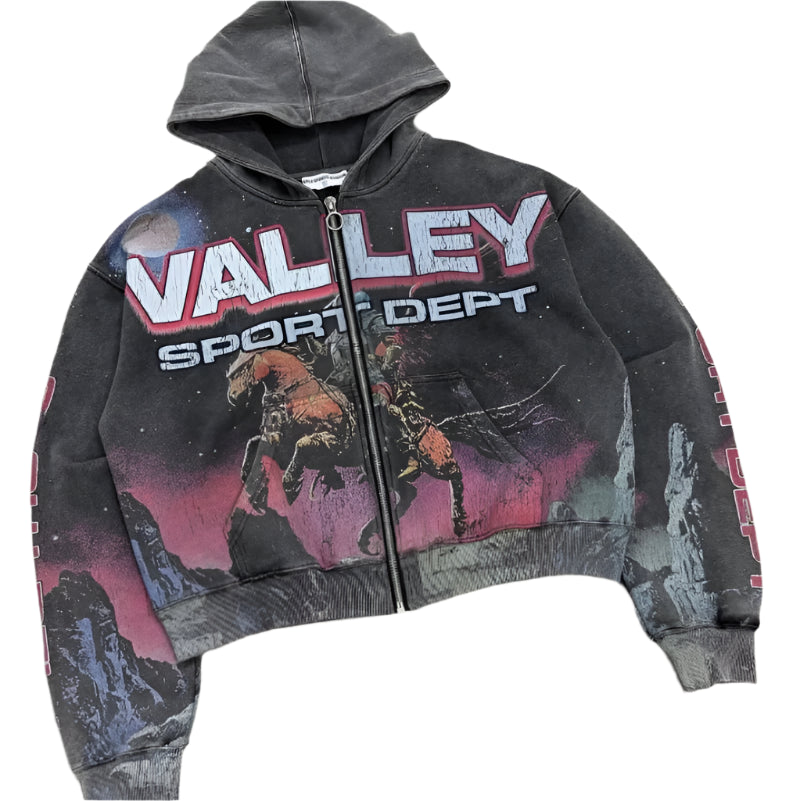 Black hoodie with 'Valley Sport Dept' text and graphic design on a concrete floor.