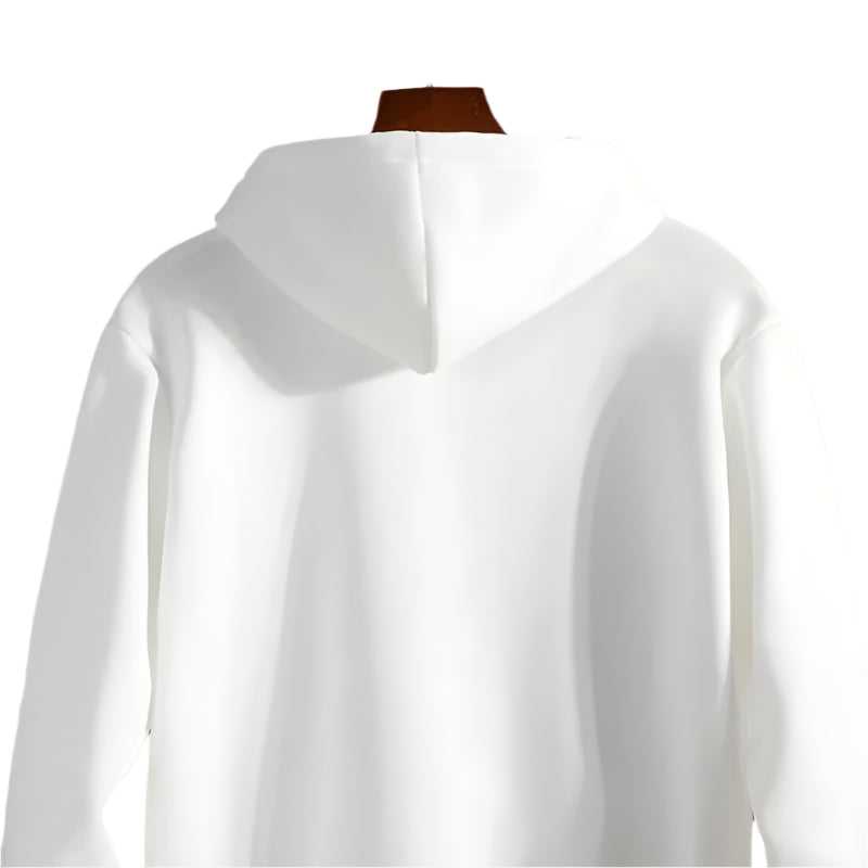 White hoodie on a mannequin against a stone wall background