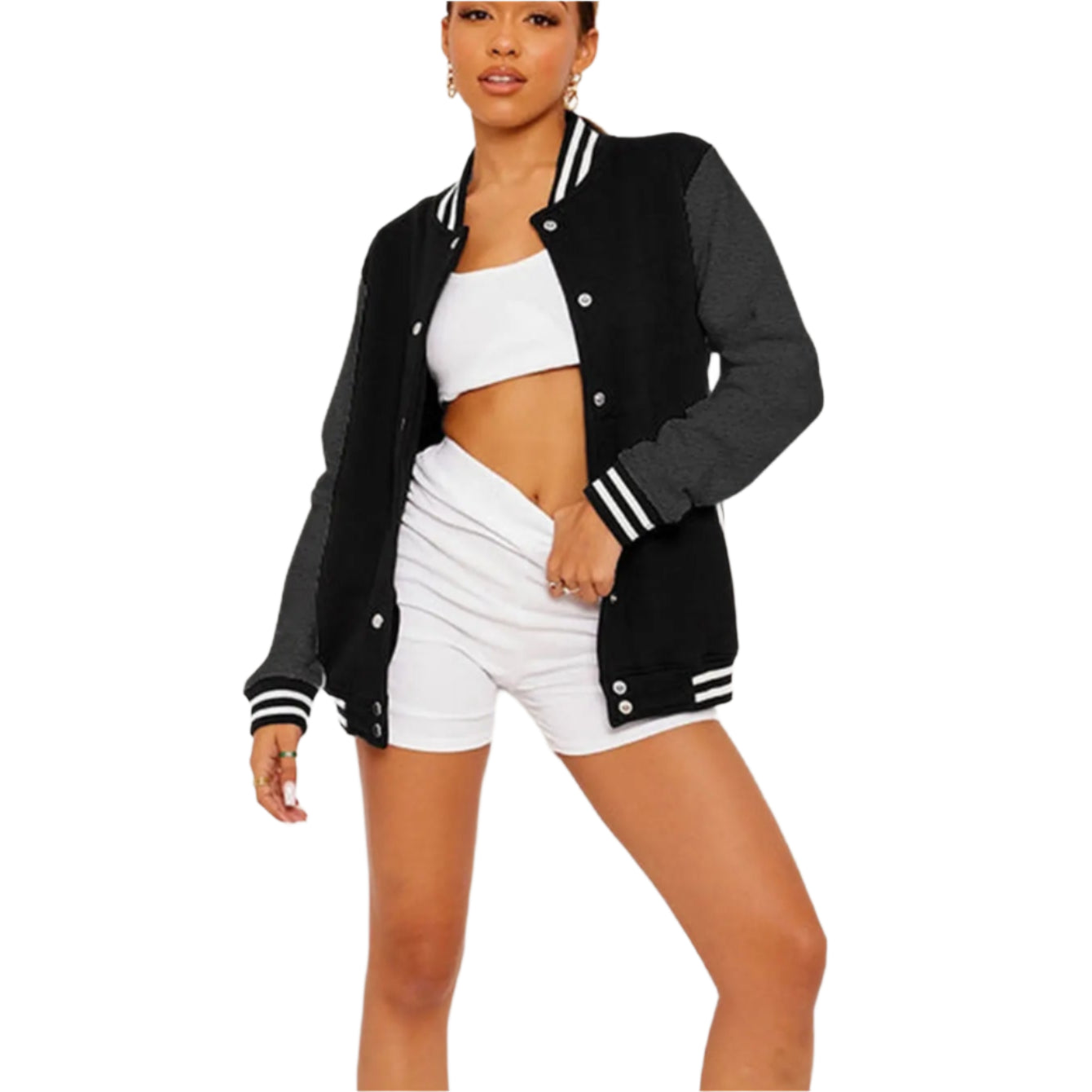 Woman wearing a black and white varsity jacket with white shorts on a light gray background