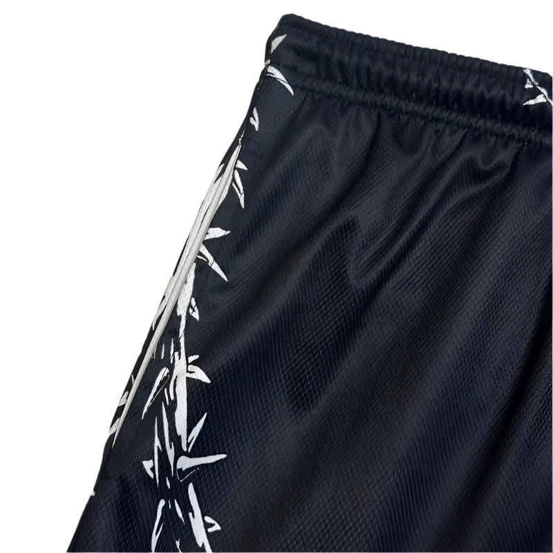 Black shorts with white barbed wire pattern on a white background