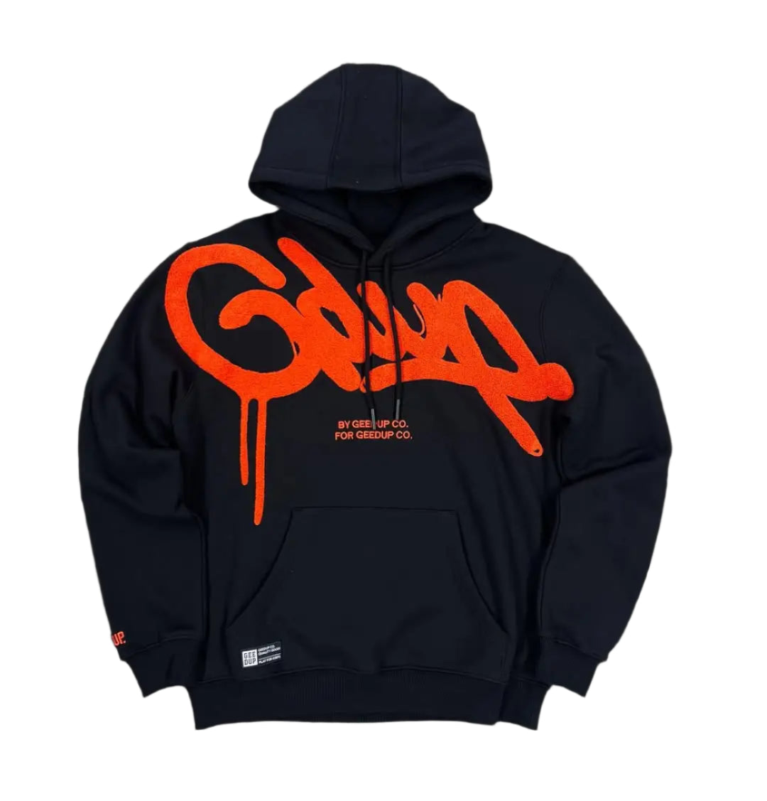 Black hoodie with orange logo on a gray textured background