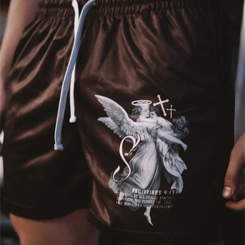 Brown shorts with an angel graphic on a person's waistband.