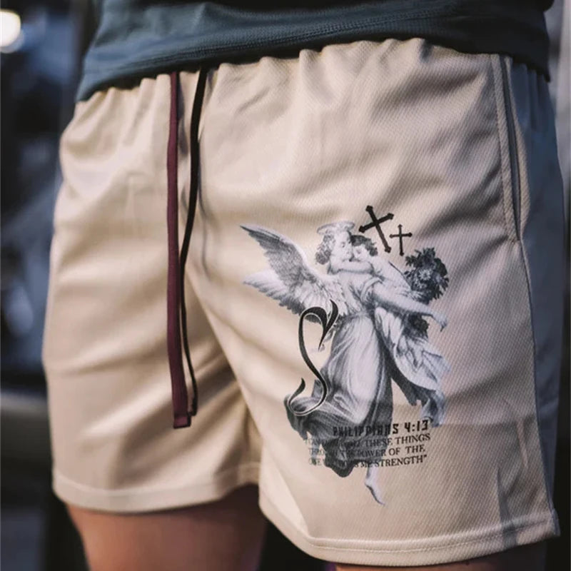 Beige shorts with an angel and cross design on a blurred background
