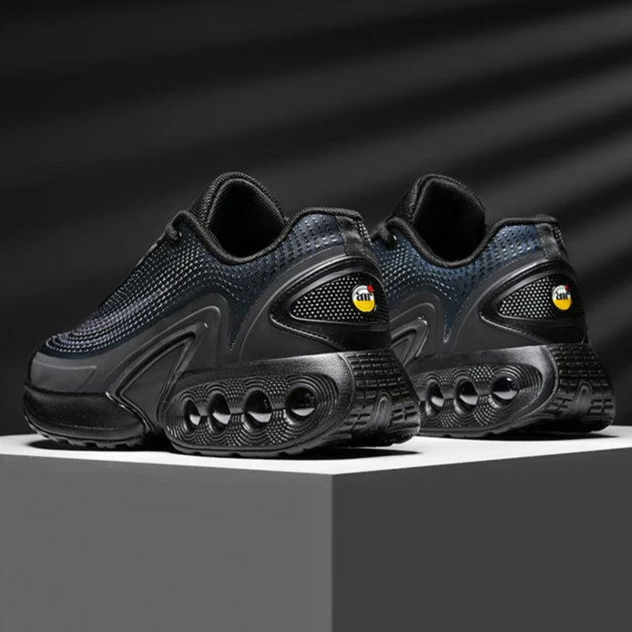 Black athletic shoes on a dark background with text above them.