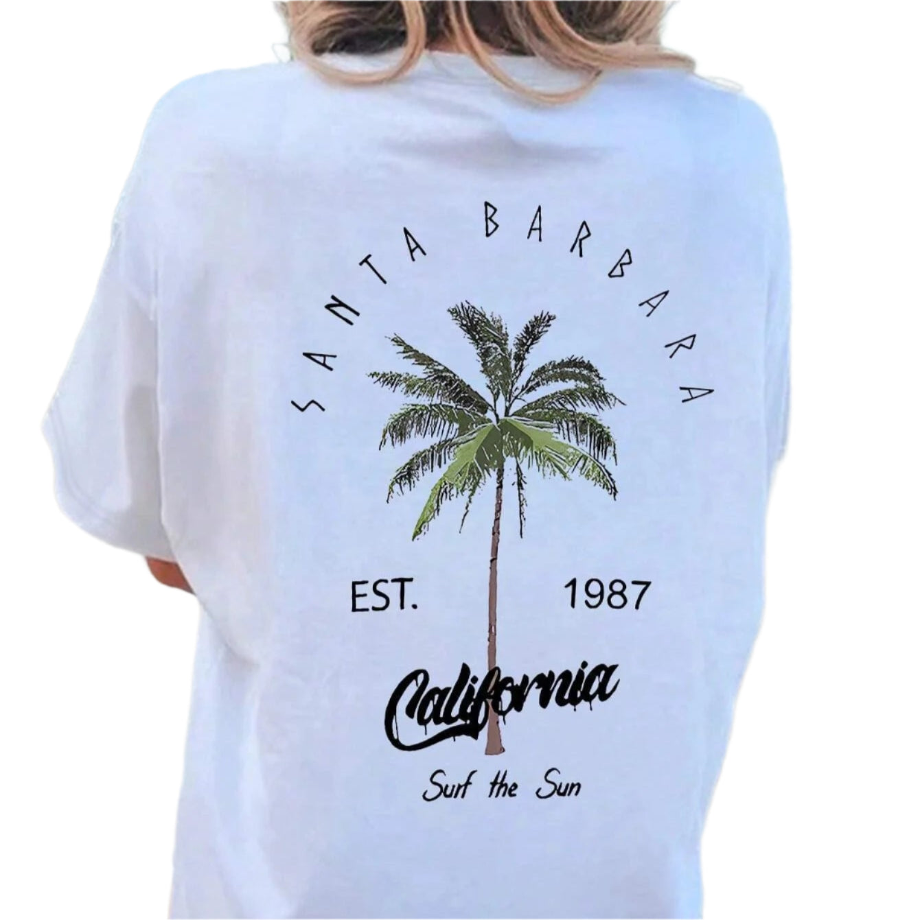 Person wearing a white t-shirt with 'Santa Barbara California' text and palm tree graphic on a beach.