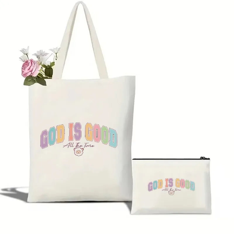Tote bag and pouch with 'God is Good' text on a white background