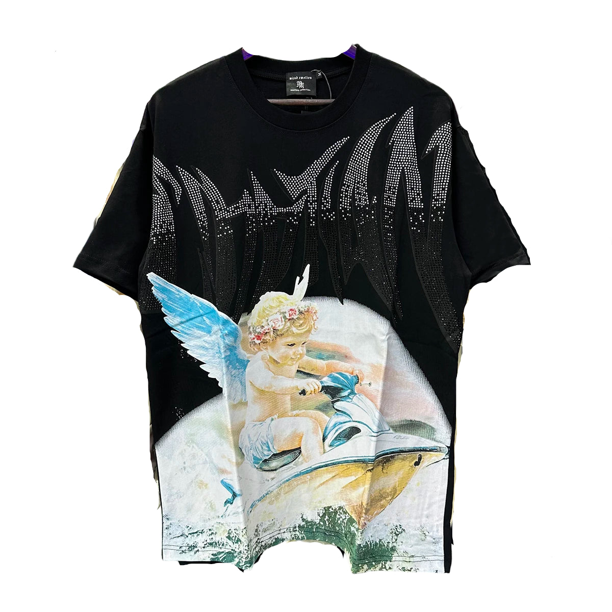 Black t-shirt with angel graphic design hanging on a rack with other clothes.
