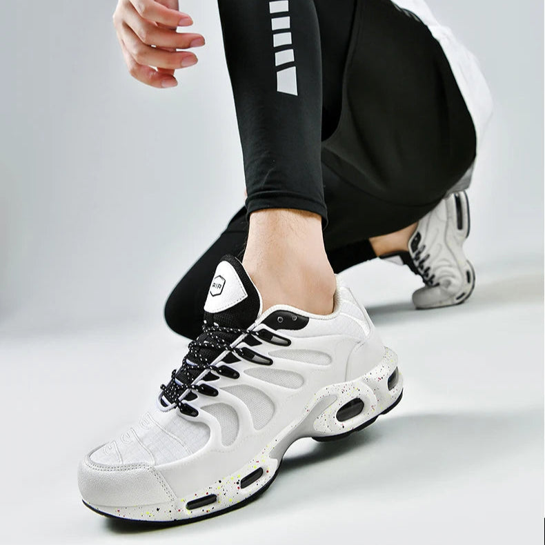 Person wearing black leggings and white sneakers with a gray background