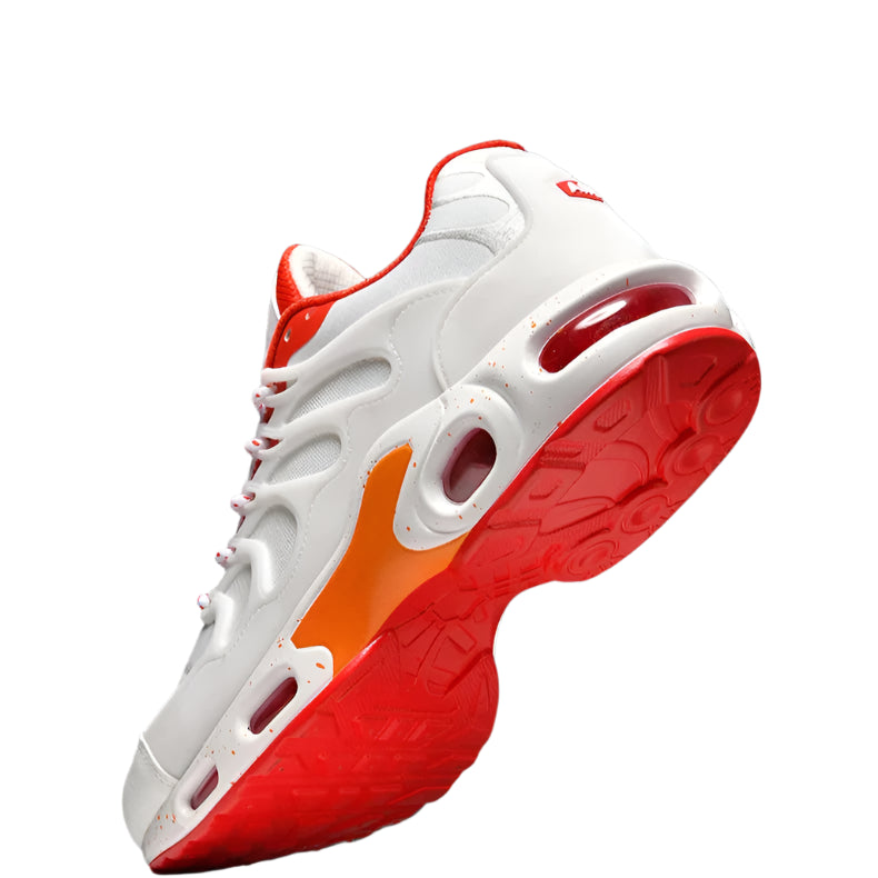 White and red sneaker with orange accents on a dark background