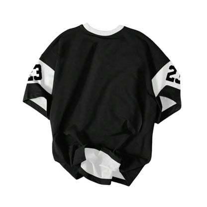 Black sweatshirt with white numbers on a gray surface