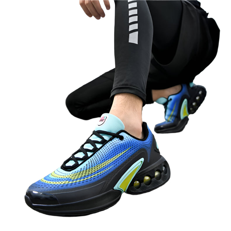 Person wearing blue and black athletic shoes on a bridge
