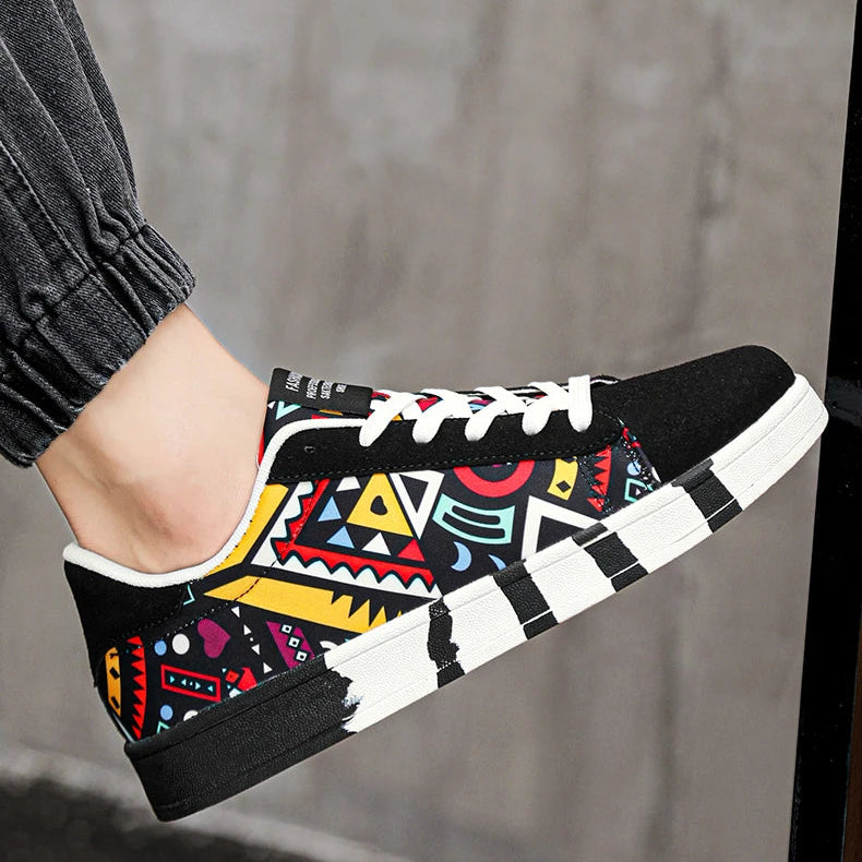 Colorful tribal-patterned sneaker worn by a person with a blurred background