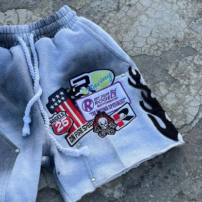 Gray sweatshirt with patches on a textured surface