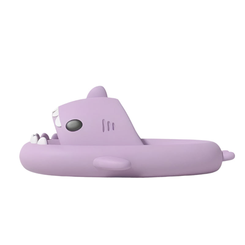 Purple shark-shaped inflatable pool raft on a light background