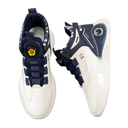 White sneakers with navy accents on a dark surface with jeans underneath