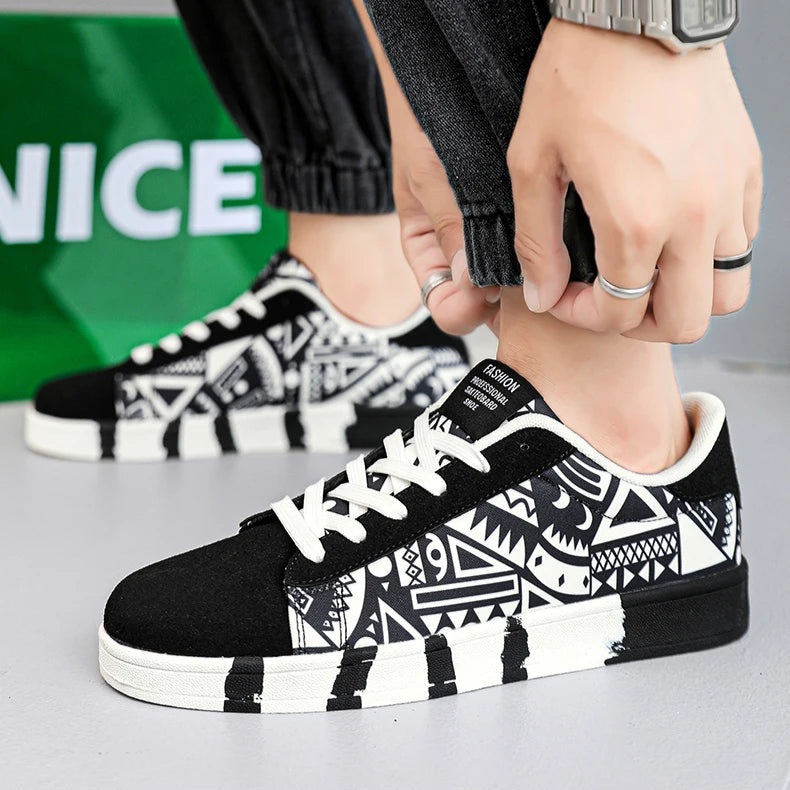 Person wearing black and white patterned sneakers with a visible brand logo in the background.