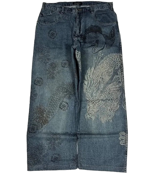 Blue jeans with intricate patterns on a white background