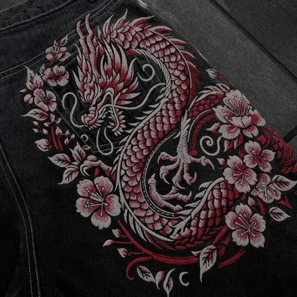 Embroidered dragon design on a black fabric background