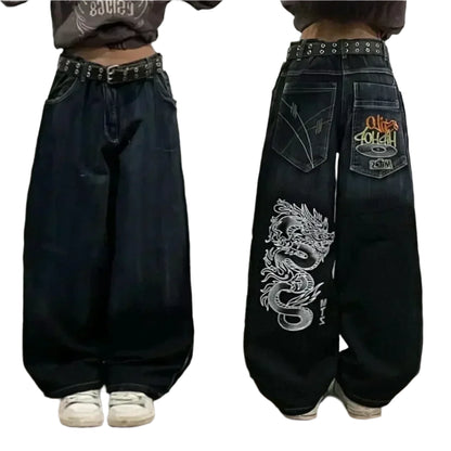 Black wide-leg jeans with dragon design and brand logo on a plain background