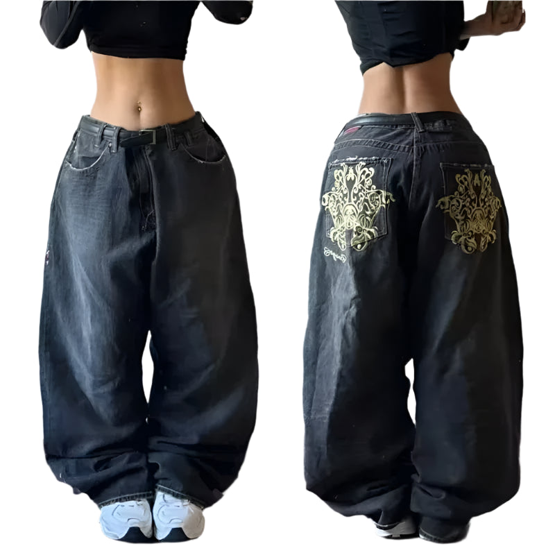 Black wide-leg jeans with gold embroidery on a plain background