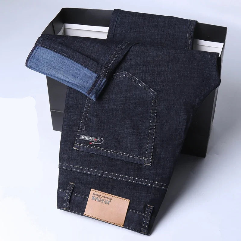 Dark blue jeans with a brand logo on a white background