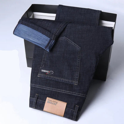 Dark blue jeans with a brand logo on a white background