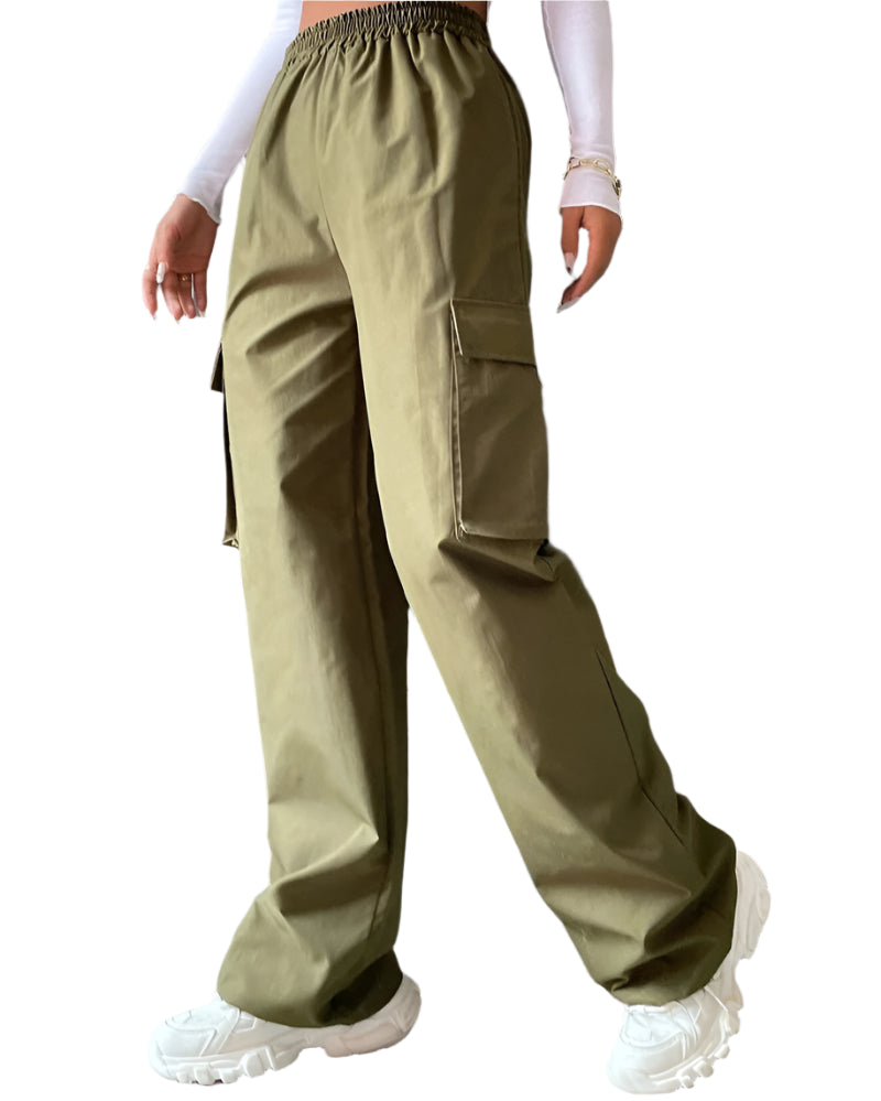 Person wearing olive green cargo pants with a plain background
