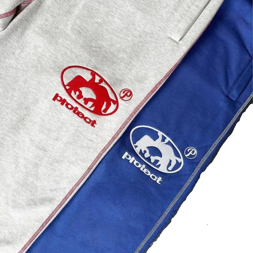Gray and blue jacket with 'protect' logo on a dark surface