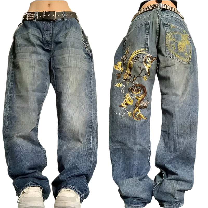 Blue jeans with intricate embroidery on a black and white patterned background