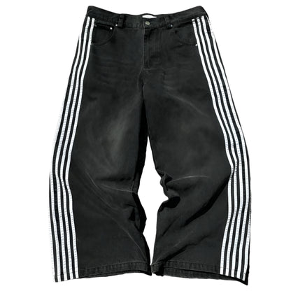 Black pants with white stripes on a light gray background