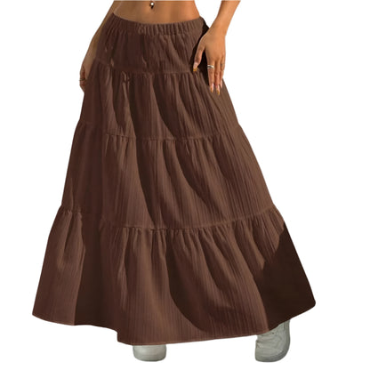 Brown tiered skirt worn by a person against a neutral background