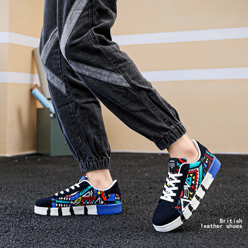 Person wearing colorful sneakers with 'TIDAL DESERT' branding on a plain background