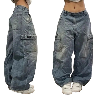 Blue baggy jeans worn by a person on a plain background