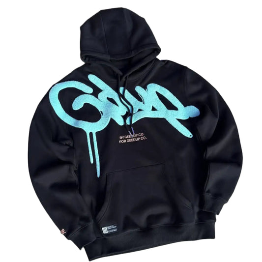 Black hoodie with blue logo on a gray surface