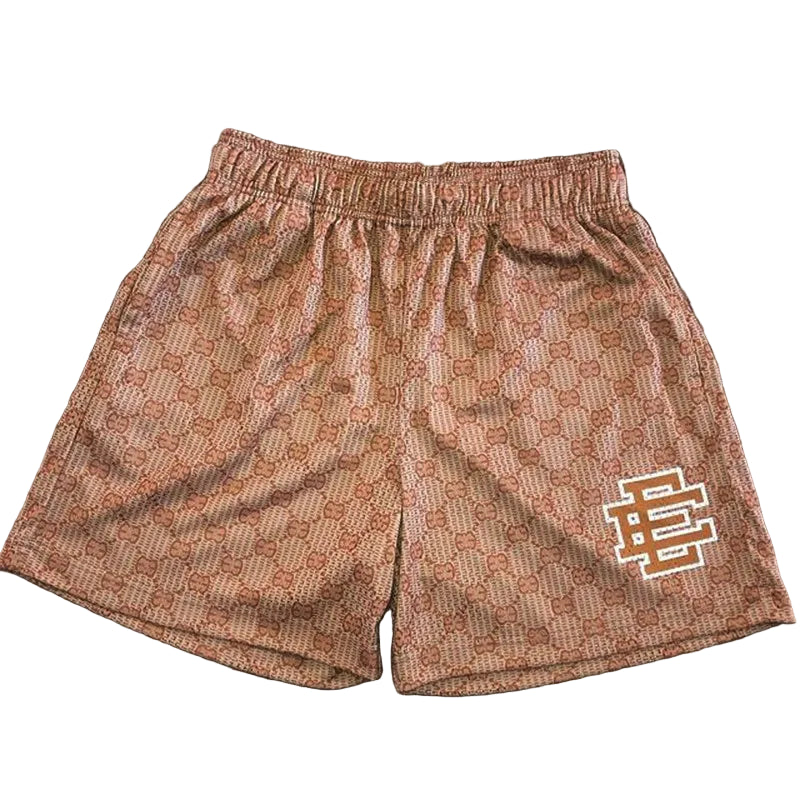 Patterned shorts with a logo on a wooden surface