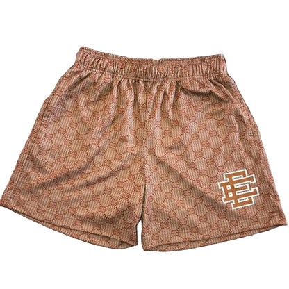 Patterned shorts with a logo on a wooden surface