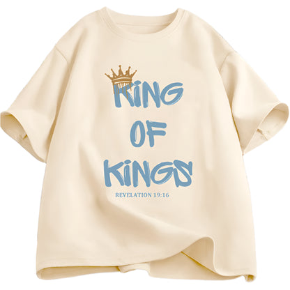 Beige t-shirt with 'King of Kings' text and crown graphic on a grid background